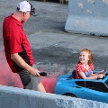 Father and daughter smiling.